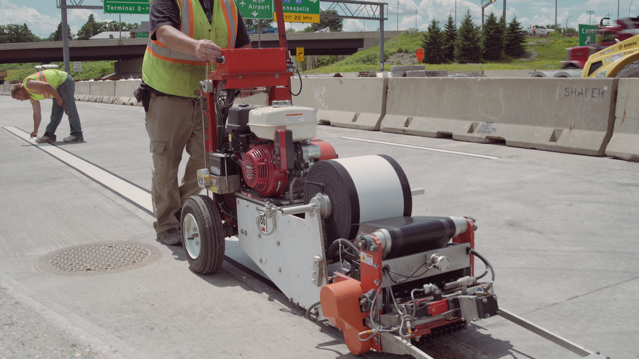 Grooving machine recessing a highway marking